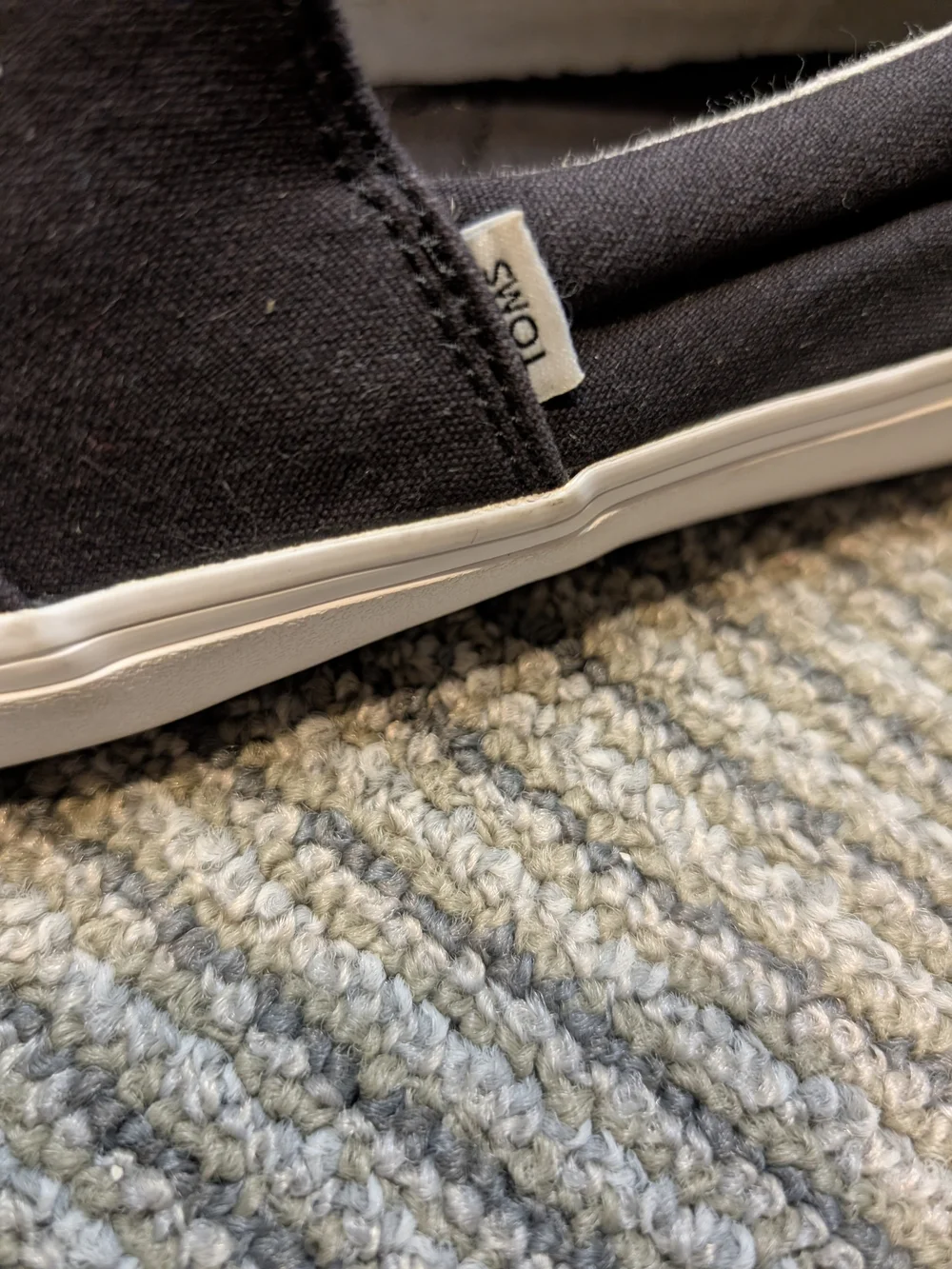 TOMS kids Black Canvas Slip-On Loafers with White Sole